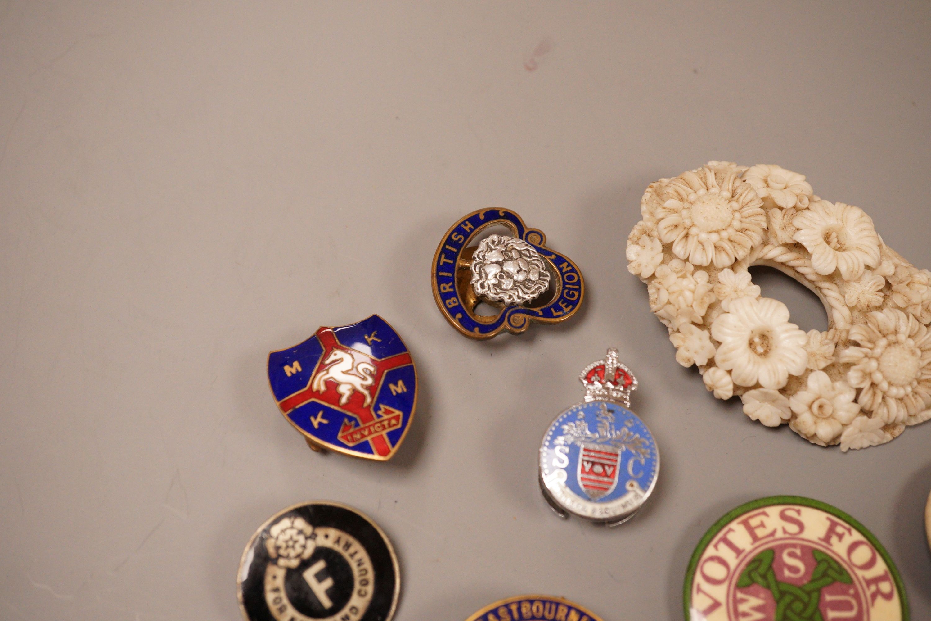 A selection of badges, to include Suffragette Women's Social and Political Union ‘Votes For Women’, Eastbourne Association of Sussex Folk, and others